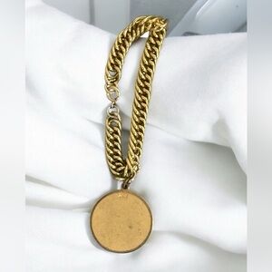 Gold tone Bracelet w/ pendant